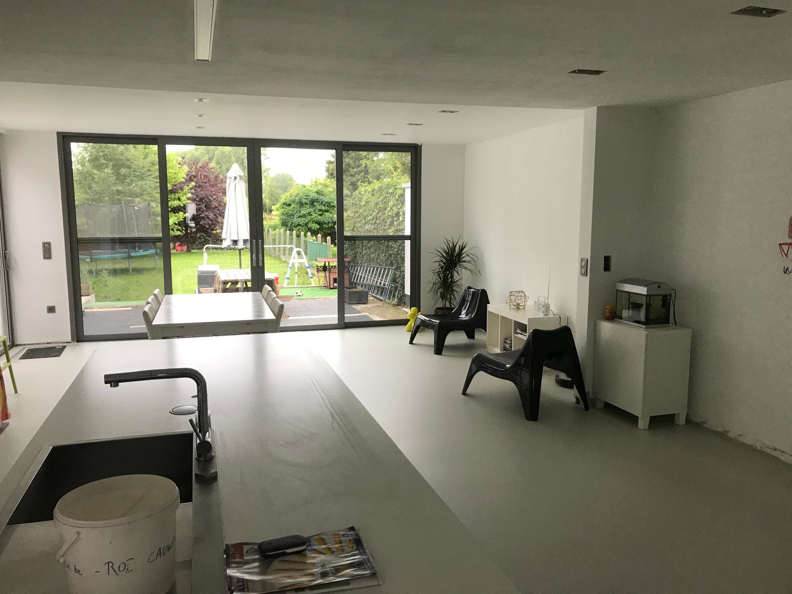 Open living space repainted in clean light grey